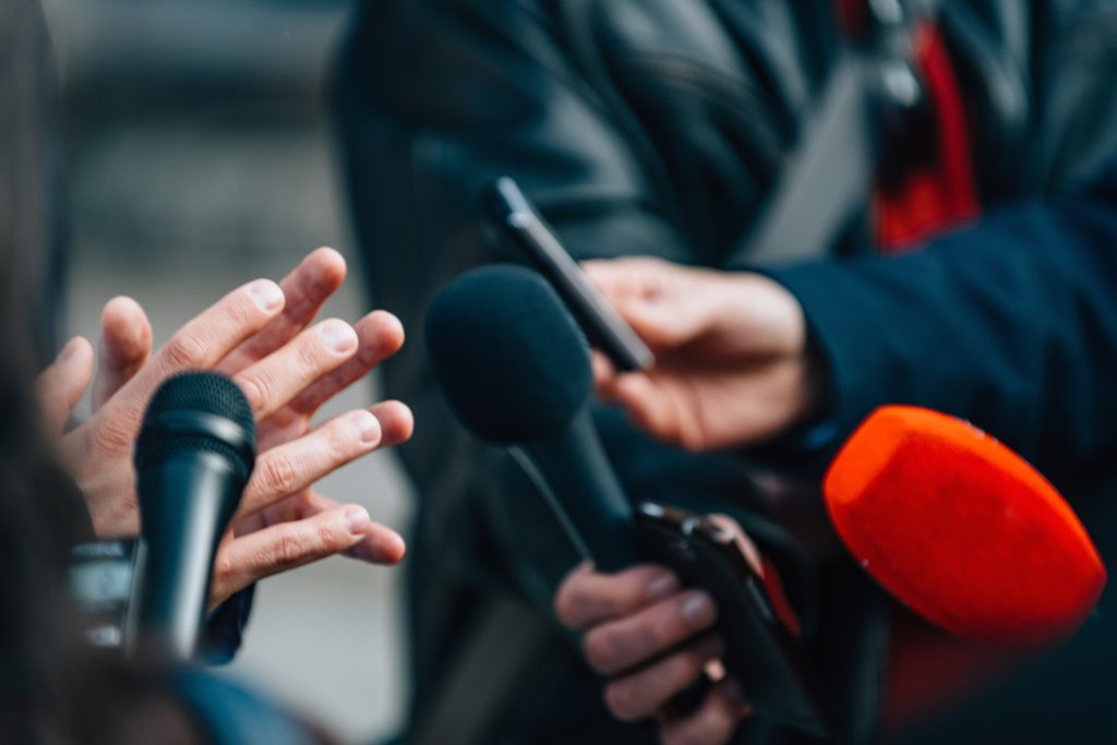 Interviewing businessman on press conference